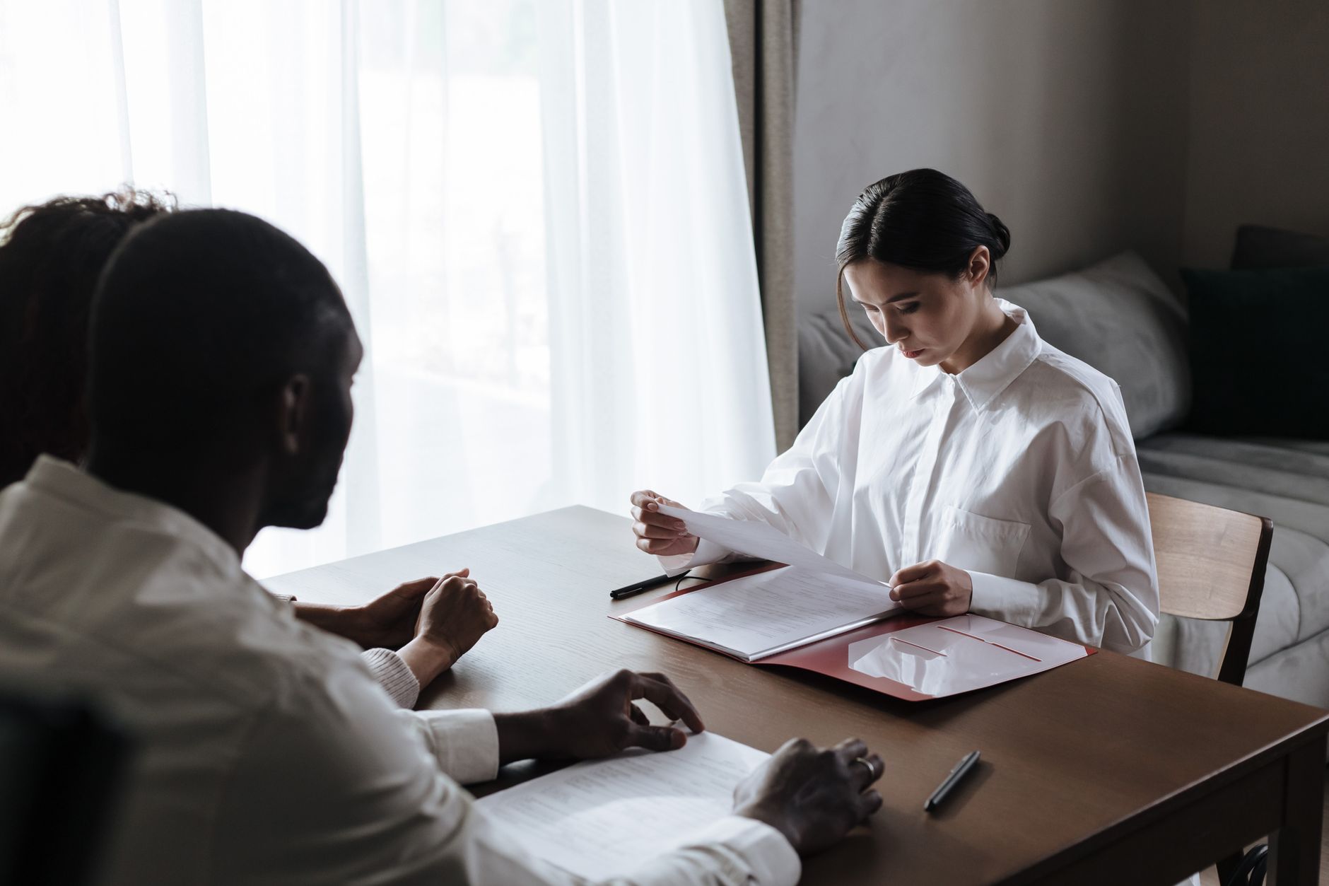 Two professionals reviewing information together at a table